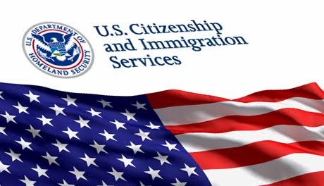 U.S. Citizenship and Immigration Services logo over an American flag